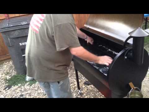 Traeger pellet grill set up and cooking on grill.